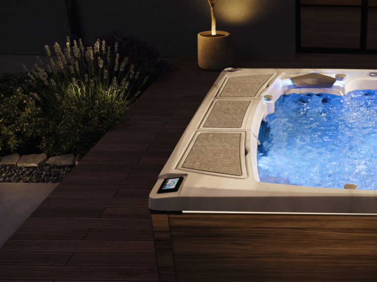 Sundance Spas 980 Series hot tub exterior LED lighting at night
