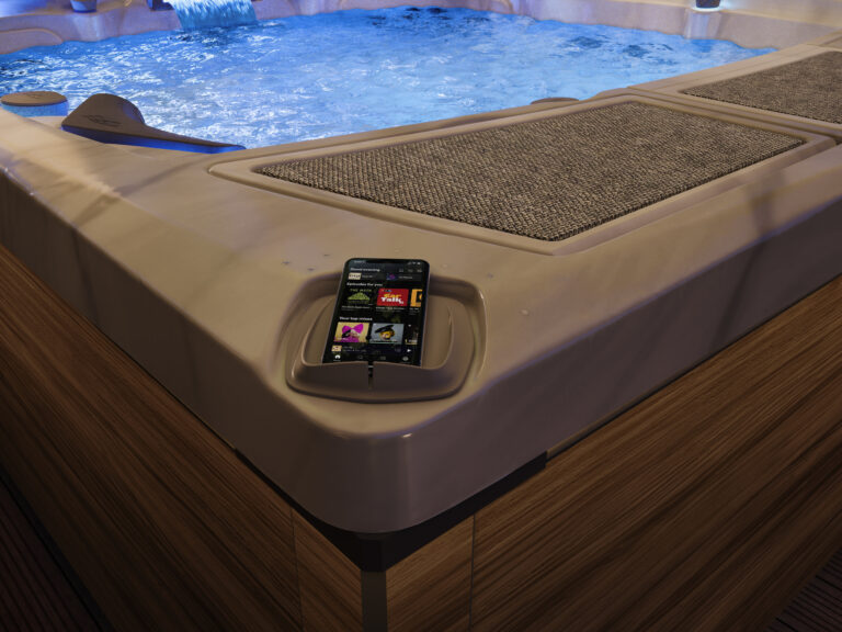 Sundance Spas 980 Series wireless charging dock with phone